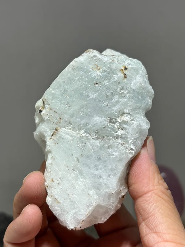 Opaque aquamarine single crystal from Xuebaoding, Sichuan, China, close-up of the crystal faces