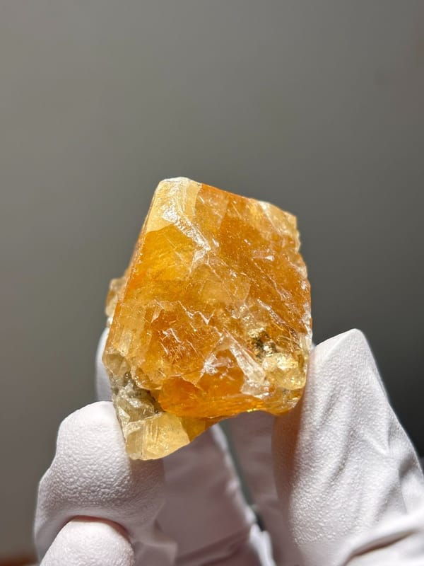 Orange scheelite crystal from Xuebaoding, Sichuan, China, view 2 of 5