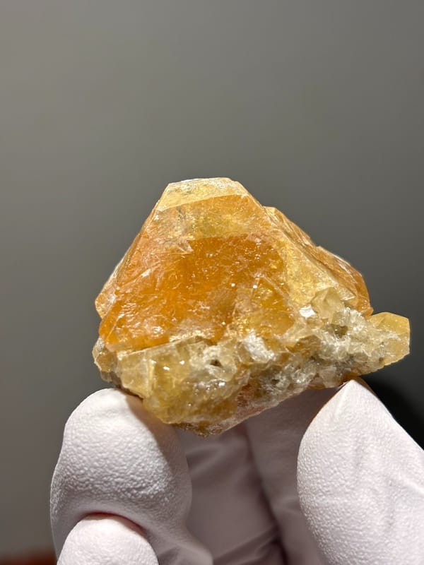 Orange scheelite crystal from Xuebaoding, Sichuan, China, view 3 of 5