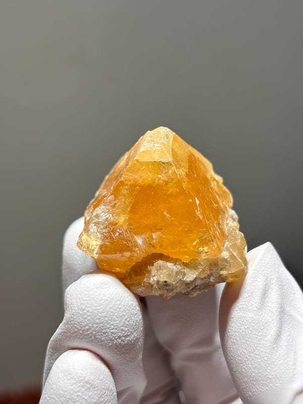 Orange scheelite crystal from Xuebaoding, Sichuan, China, view 4 of 5