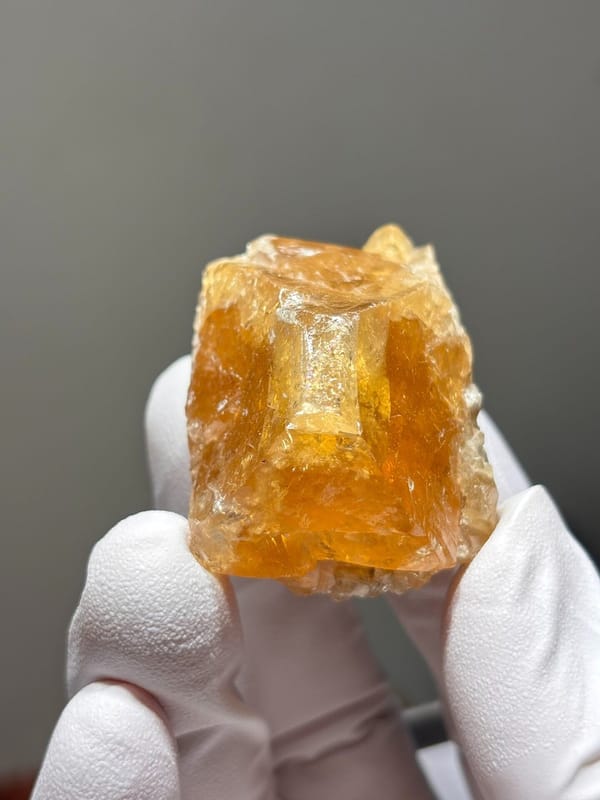 Orange scheelite crystal from Xuebaoding, Sichuan, China, view 5 of 5