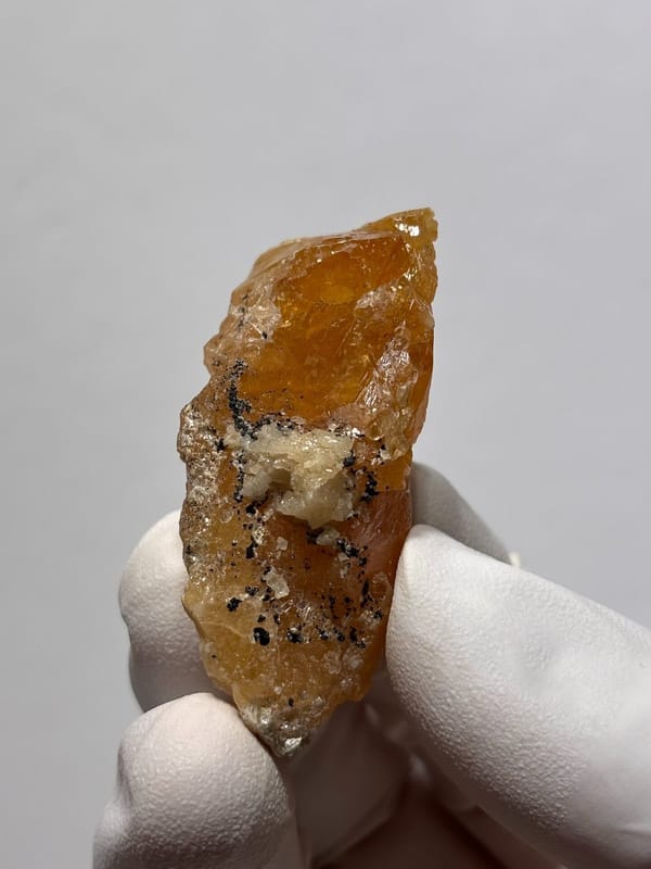 Orange scheelite floater from Xuebaoding, Sichuan, China