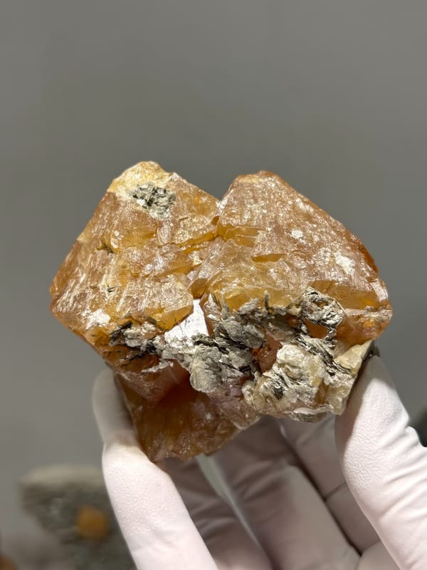 Large orange scheelite crystal group from Xuebaoding, Sichuan, China, reverse side