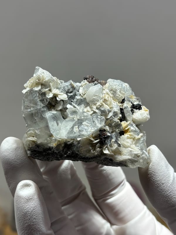 Pale aquamarine with black cassiterite and mica from Xuebaoding, Sichuan, China, second angle