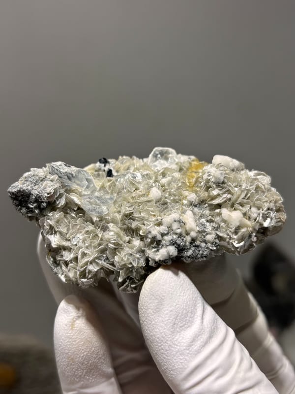 Pale aquamarine with black cassiterite, mica and feldspar from Xuebaoding, Sichuan, China, second angle
