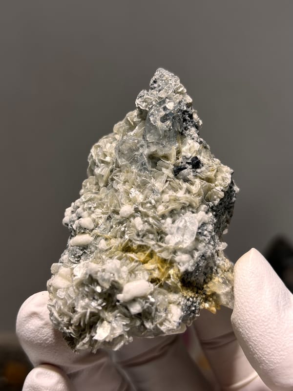 Pale aquamarine with black cassiterite, mica and feldspar from Xuebaoding, Sichuan, China, reverse side