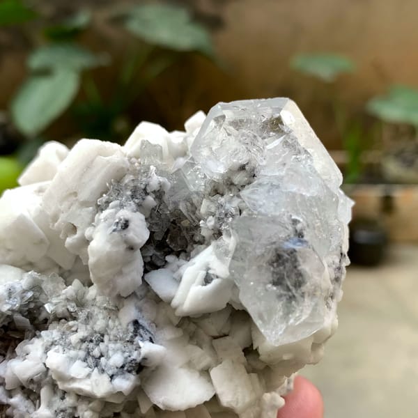 Pale aquamarine crystal on white feldspar with mica from Xuebaoding, Sichuan, China, second angle