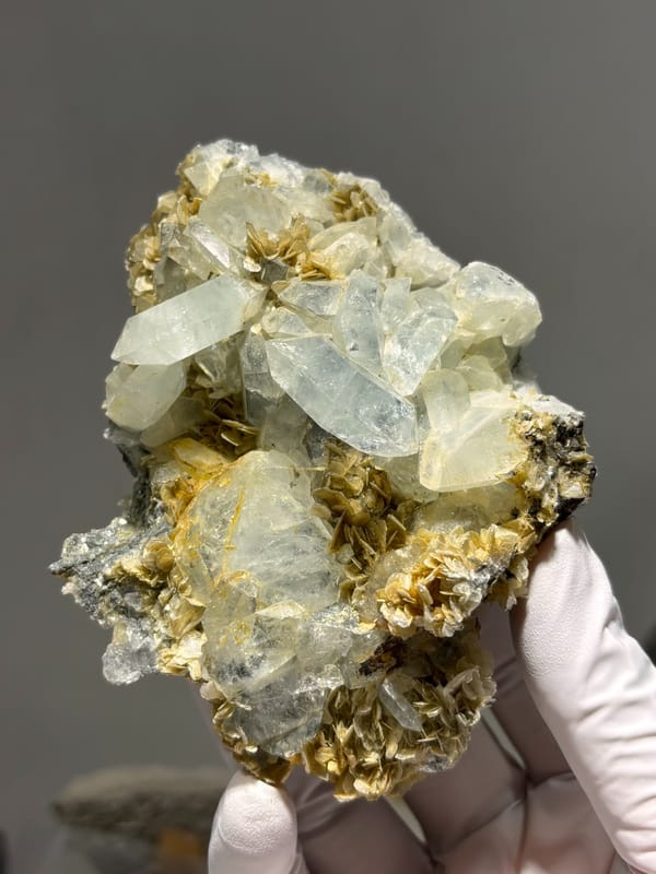 Plate of pale aquamarine crystals on mica from Xuebaoding, Sichuan, China, reverse side