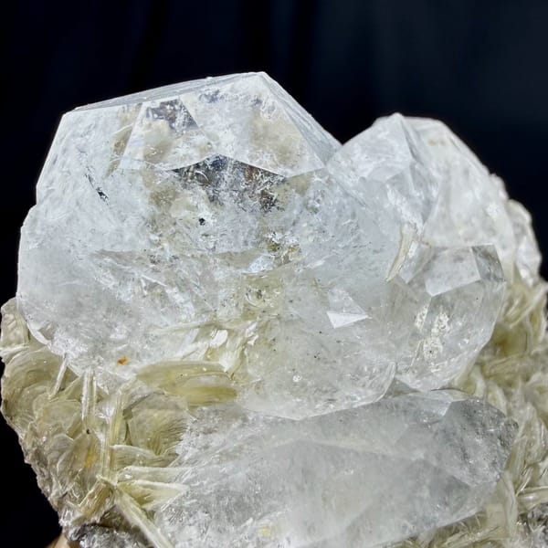 Pale aquamarine prism on muscovite needles from Xuebaoding, Sichuan, China, view 2 of 6