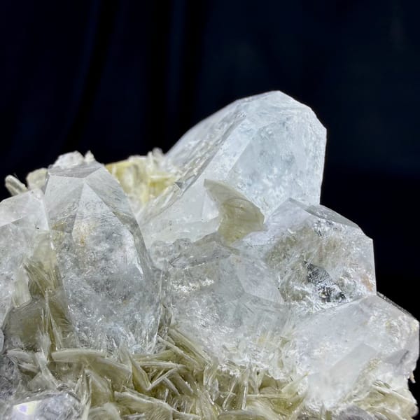 Pale aquamarine prism on muscovite needles from Xuebaoding, Sichuan, China, view 3 of 6