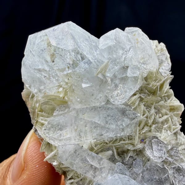 Pale aquamarine prism on muscovite needles from Xuebaoding, Sichuan, China, view 4 of 6