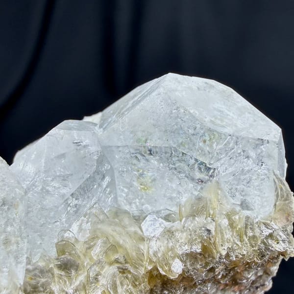 Pale aquamarine prism on muscovite needles from Xuebaoding, Sichuan, China, view 5 of 6
