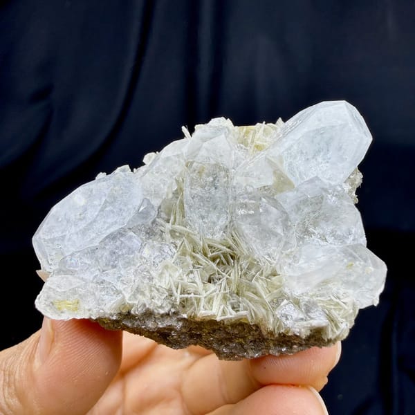 Pale aquamarine prism on muscovite needles from Xuebaoding, Sichuan, China, view 6 of 6