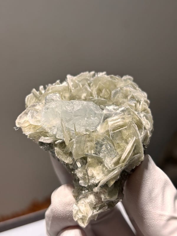 Pale aquamarine set in mica rosette from Xuebaoding, Sichuan, China, view 3 of 5