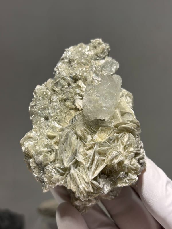 Pale aquamarine on golden mica plate from Xuebaoding, Sichuan, China, second angle