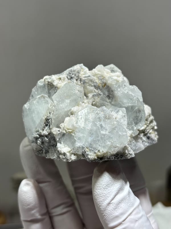 Pale blue aquamarine crystals on white feldspar from Xuebaoding, Sichuan, China, second angle