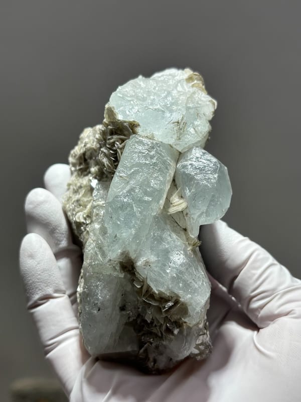 Pale blue aquamarine crystals over grey mica from Xuebaoding, Sichuan, China, second angle