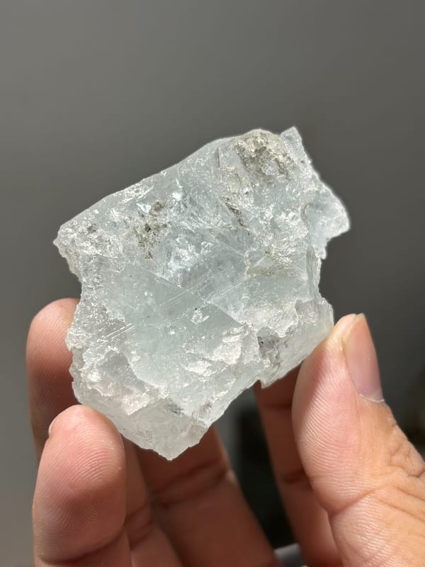 Pale blue aquamarine block with etched faces from Xuebaoding, Sichuan, China, reverse side