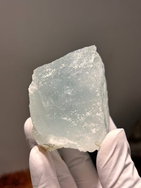 Pale blue aquamarine block from Xuebaoding, Sichuan, China, reverse side