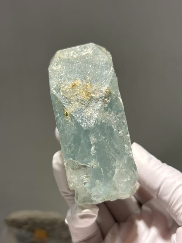 Pale blue-green aquamarine block from Xuebaoding, Sichuan, China, side view