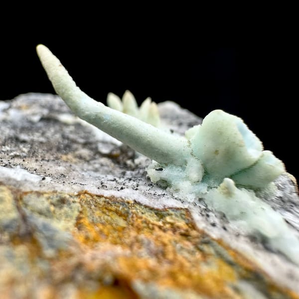 Pale blue aragonite finger on grey rock wedge from Yunnan, China, view 5 of 6