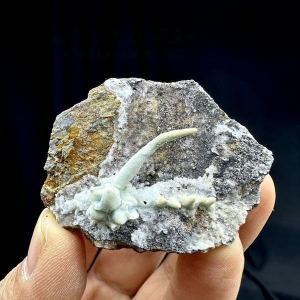 Pale blue aragonite finger on grey rock wedge from Yunnan, China, view 6 of 6