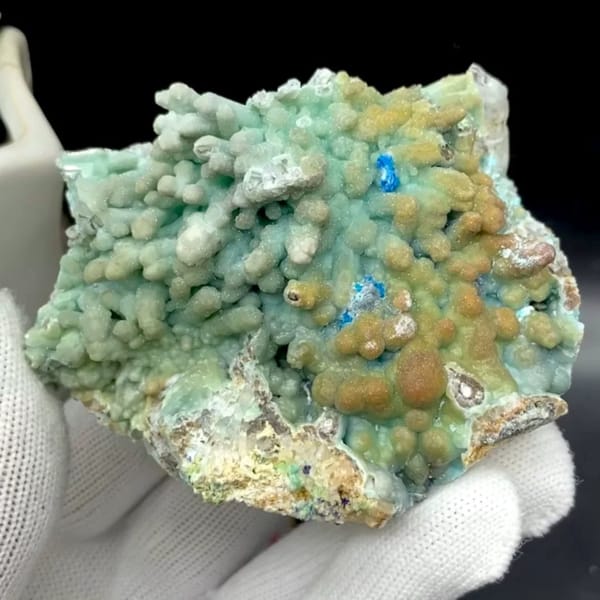 Pale blue botryoidal hemimorphite wrapping quartz from Yunnan, China