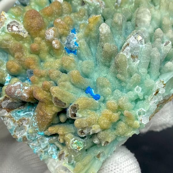 Pale blue botryoidal hemimorphite wrapping quartz from Yunnan, China, view 4 of 9