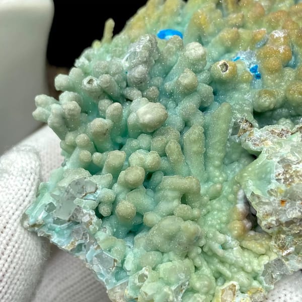 Pale blue botryoidal hemimorphite wrapping quartz from Yunnan, China, view 6 of 9