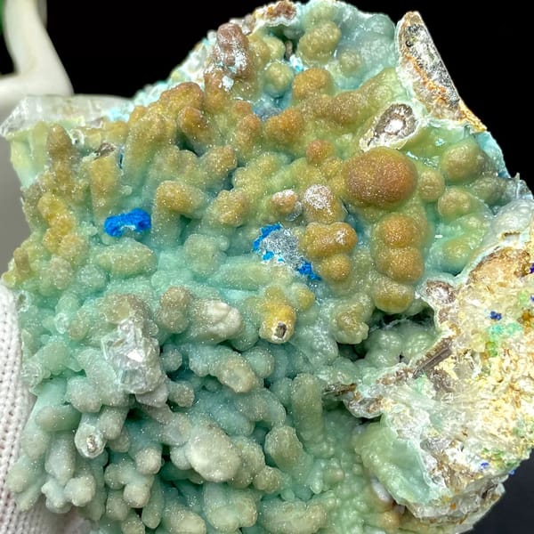 Pale blue botryoidal hemimorphite wrapping quartz from Yunnan, China, view 7 of 9