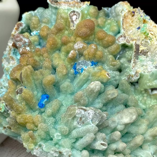Pale blue botryoidal hemimorphite wrapping quartz from Yunnan, China, view 8 of 9