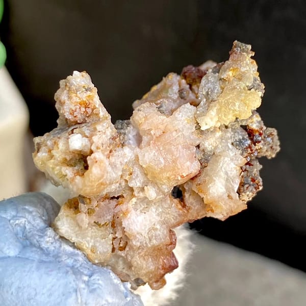 Pale cerussite crystals on rusty matrix from Guangxi, China, view 4 of 6
