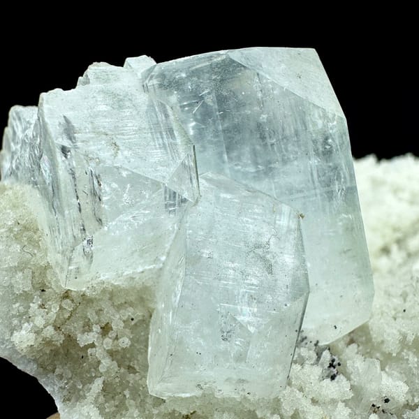 Large pale-green apophyllite crystals on white zeolite druse from India, view 3 of 6