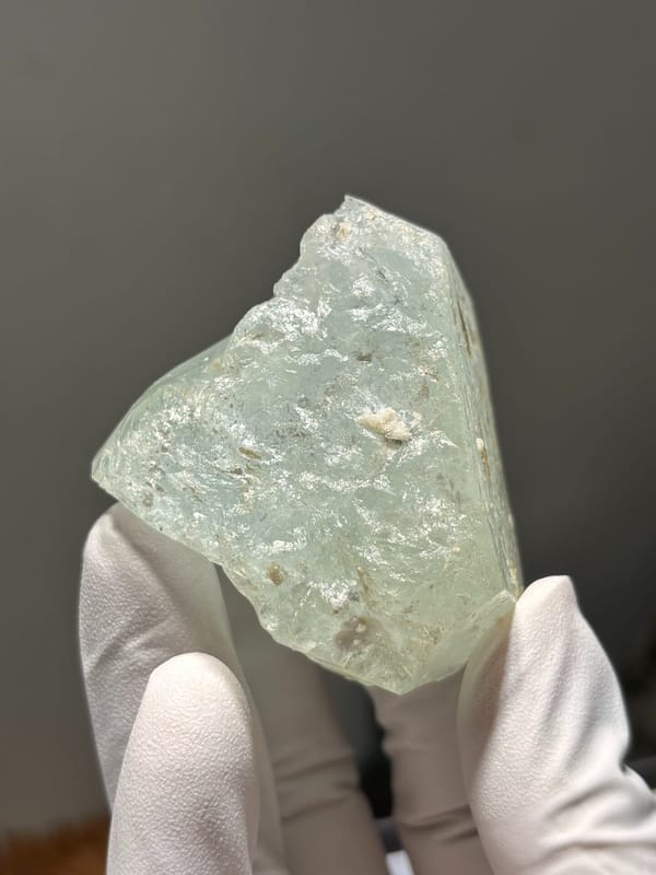 Pale green aquamarine block from Xuebaoding, Sichuan, China, close-up of the crystal faces