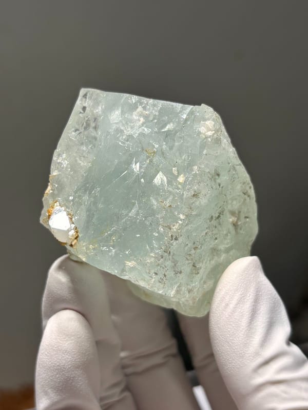 Pale green aquamarine block from Xuebaoding, Sichuan, China, reverse side