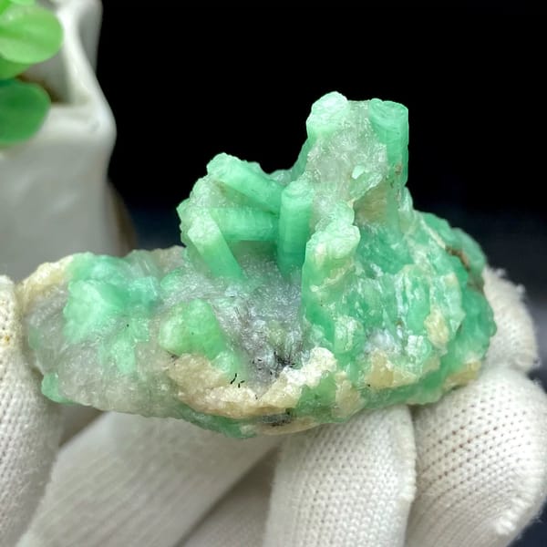 Pale green emerald crystals on rounded beryl matrix from Yunnan, China, view 2 of 9