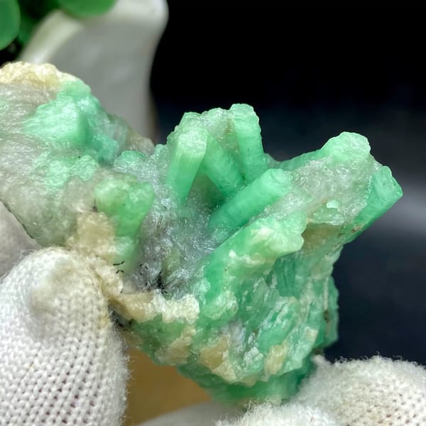 Pale green emerald crystals on rounded beryl matrix from Yunnan, China, view 7 of 9