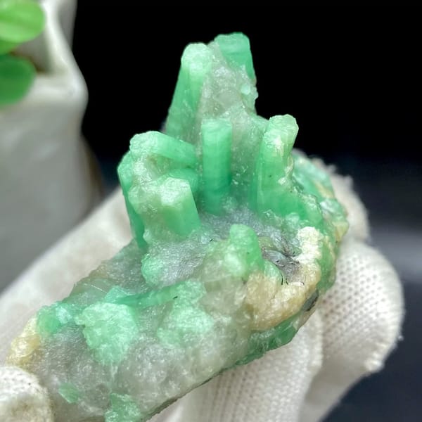 Pale green emerald crystals on rounded beryl matrix from Yunnan, China, view 8 of 9
