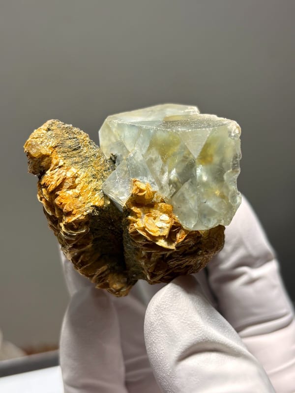 Pale green fluorite octahedron on golden mica from Xuebaoding, Sichuan, China, second angle