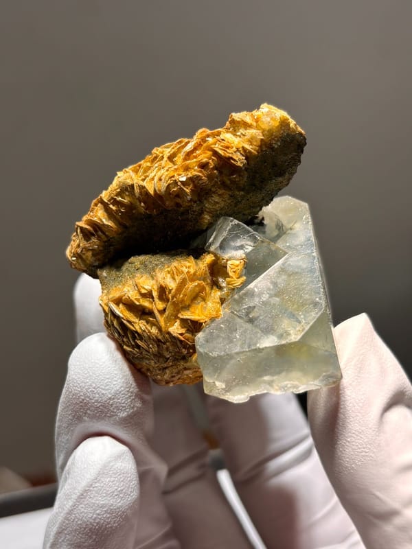 Pale green fluorite octahedron on golden mica from Xuebaoding, Sichuan, China, top view