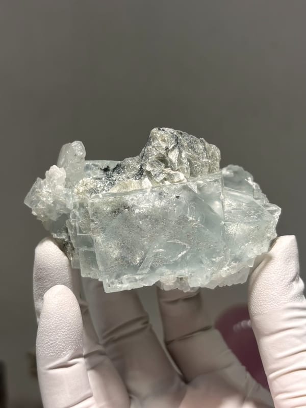 Pale green fluorite cubes with mica and albite from Xuebaoding, Sichuan, China, second angle