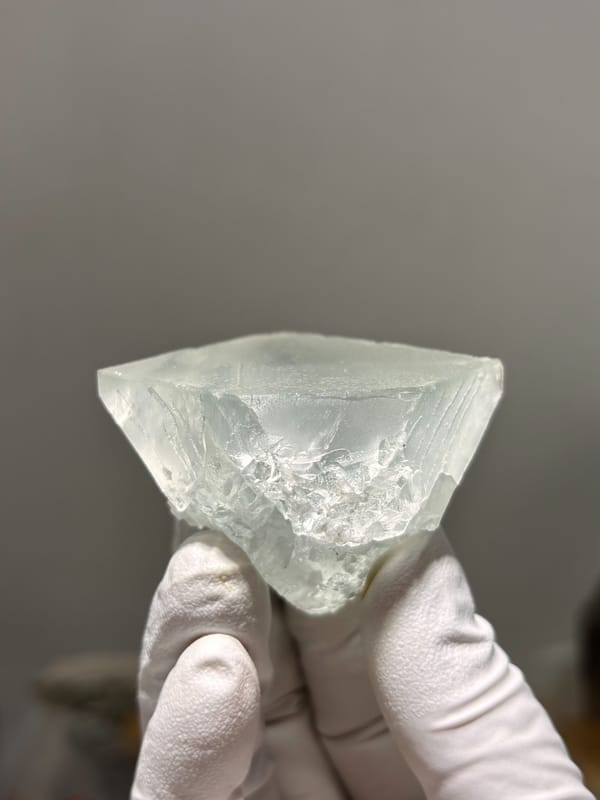 Pale green fluorite octahedron with frosted faces from Xuebaoding, Sichuan, China, reverse side