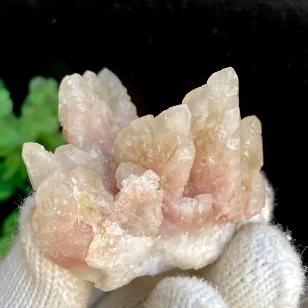Spray of pale pink calcite points from Guizhou, China, view 4 of 9