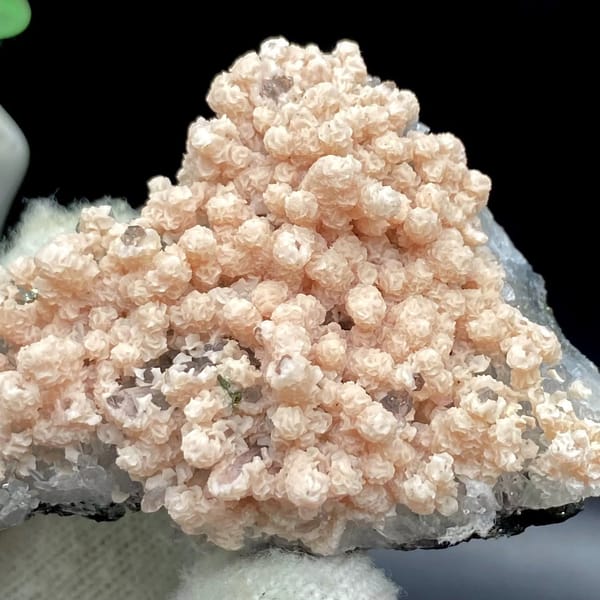 Pale pink botryoidal rhodochrosite over grey quartz from Guangxi, China, view 2 of 9