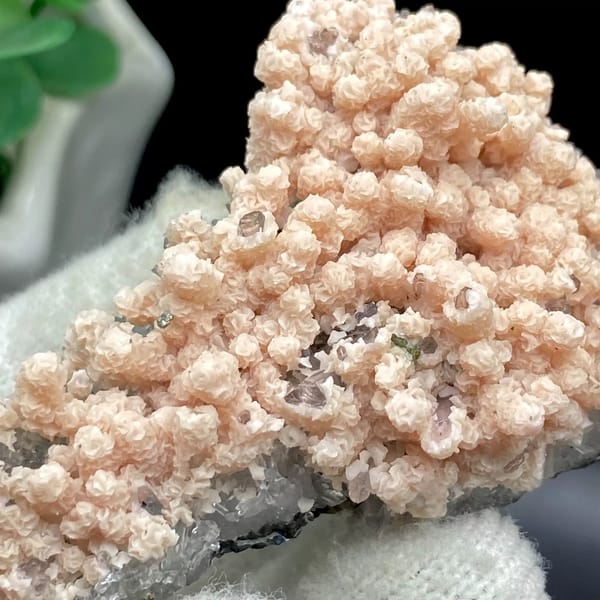 Pale pink botryoidal rhodochrosite over grey quartz from Guangxi, China, view 5 of 9