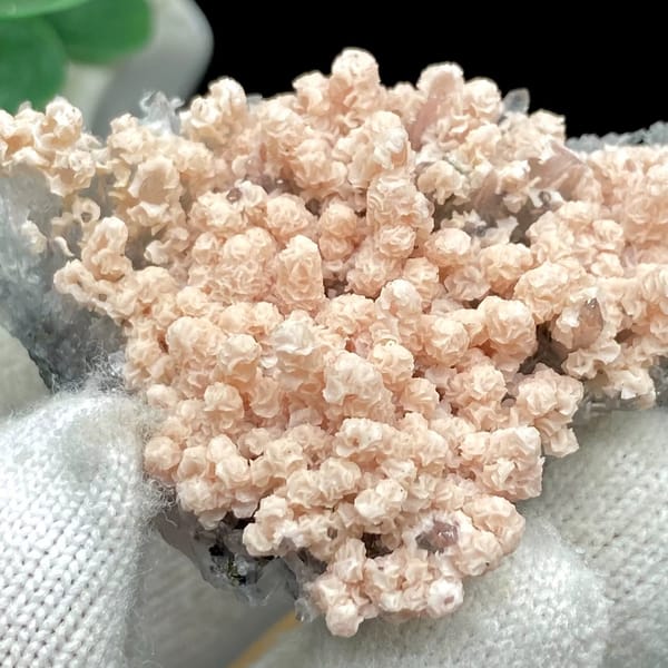 Pale pink botryoidal rhodochrosite over grey quartz from Guangxi, China, view 6 of 9