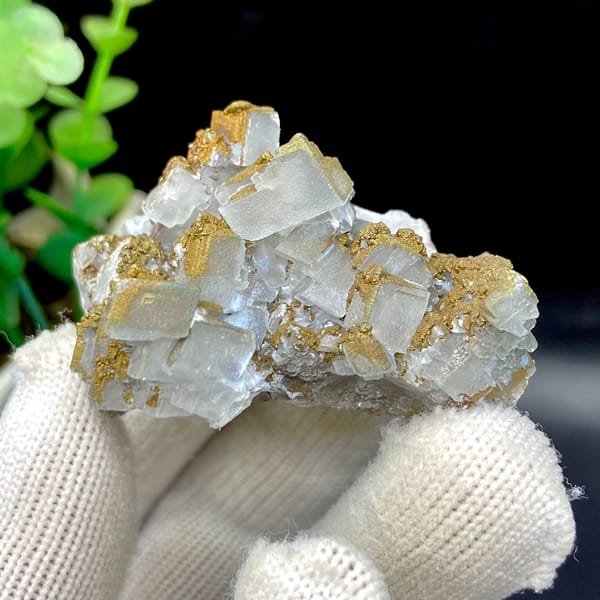 Pale pyramid calcite points with rusty pyrite film from Hunan, China, view 2 of 9