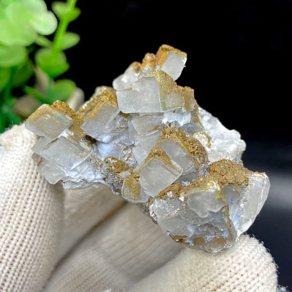 Pale pyramid calcite points with rusty pyrite film from Hunan, China, view 3 of 9