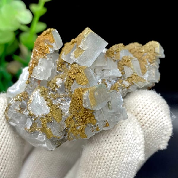Pale pyramid calcite points with rusty pyrite film from Hunan, China, view 4 of 9