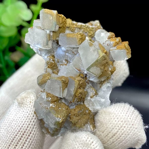 Pale pyramid calcite points with rusty pyrite film from Hunan, China, view 5 of 9
